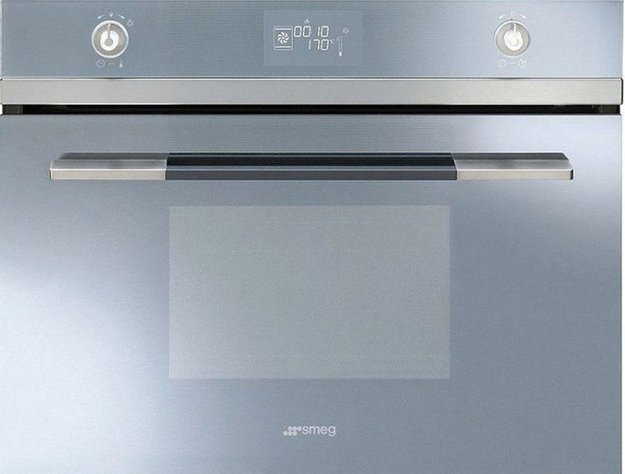 Компактный духовой шкаф с пароваркой Smeg SF4120VCS (фото 1) Компактный духовой шкаф с пароваркой Smeg SF4120VCS (preview 1)
