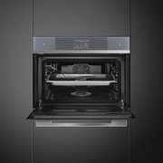 Компактный духовой шкаф с пароваркой Smeg SF4104WVCPS фото 4