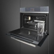 Компактный духовой шкаф с пароваркой Smeg SF4104WVCPS фото 2